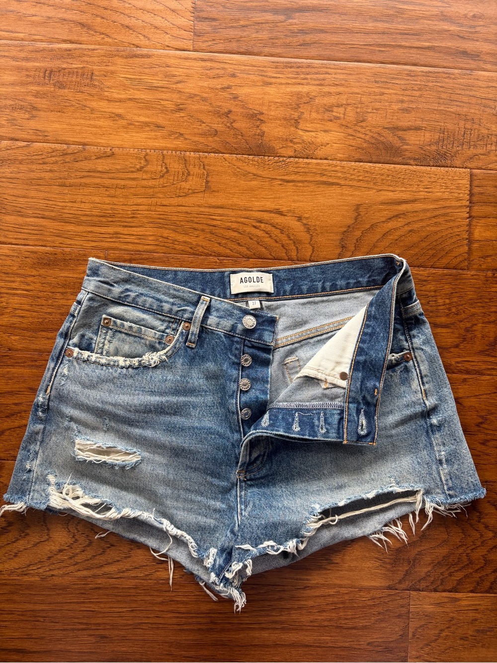 Agolde Distressed High-Rise Cutoff Jean Shorts in Light Blue Wash